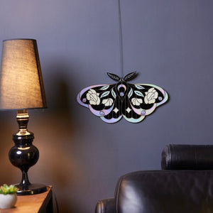 Stained glass moth wall decor styled in a nature-inspired interior