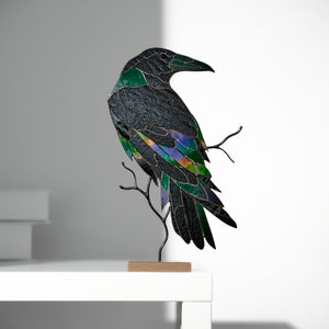 Handcrafted stained glass raven sculpture with metal branch base for table decor