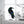 Handcrafted stained glass raven sculpture with metal branch base for table decor