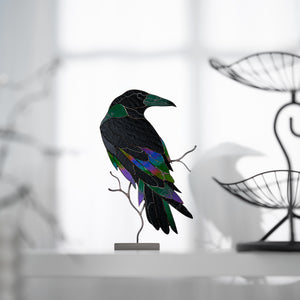 Handcrafted stained glass raven sculpture with metal branch base for table decor