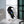 Handcrafted stained glass raven sculpture with metal branch base for table decor