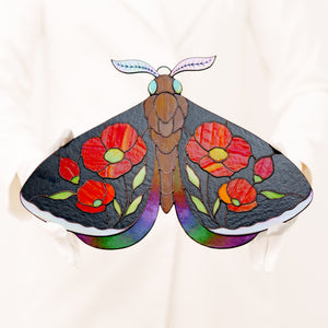Stained glass moth wall decor with red poppy flowers and dark iridescent wings