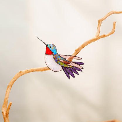 Ruby-throated hummingbird stained glass clip decor attached to a plant
