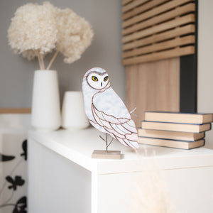 Barn owl stained glass table sculpture with warm amber tones on display