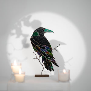 Handcrafted stained glass raven sculpture with metal branch base for table decor