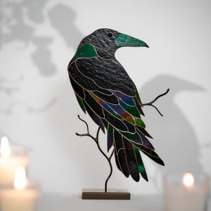 Handcrafted stained glass raven sculpture with metal branch base for table decor