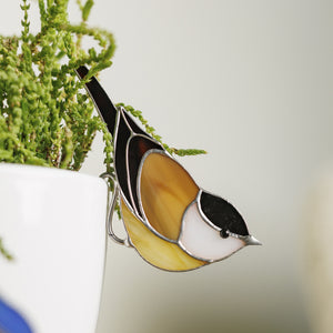 Handmade Chickadee stained glass bird suncatcher used as plant decor
