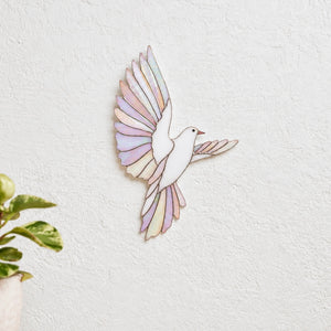 Iridescent stained glass dove wall decor symbolizing peace and hope