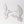 Two white dove wall decorations with iridescent pastel wings, shown on a clean white background.