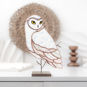 Barn owl stained glass table sculpture with warm amber tones on display